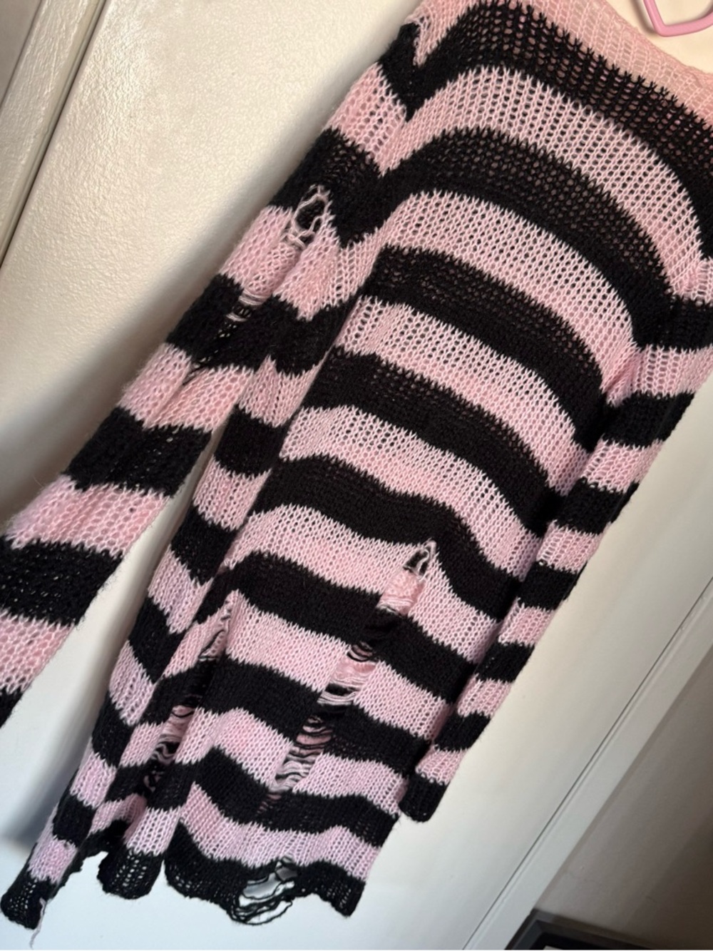 Pastel light pink and black stripped distressed oversized sweater